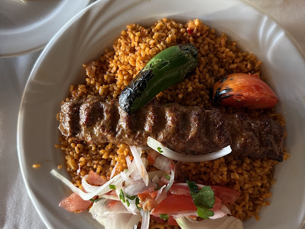 Grilled Adana kebab with bulgur pilaf