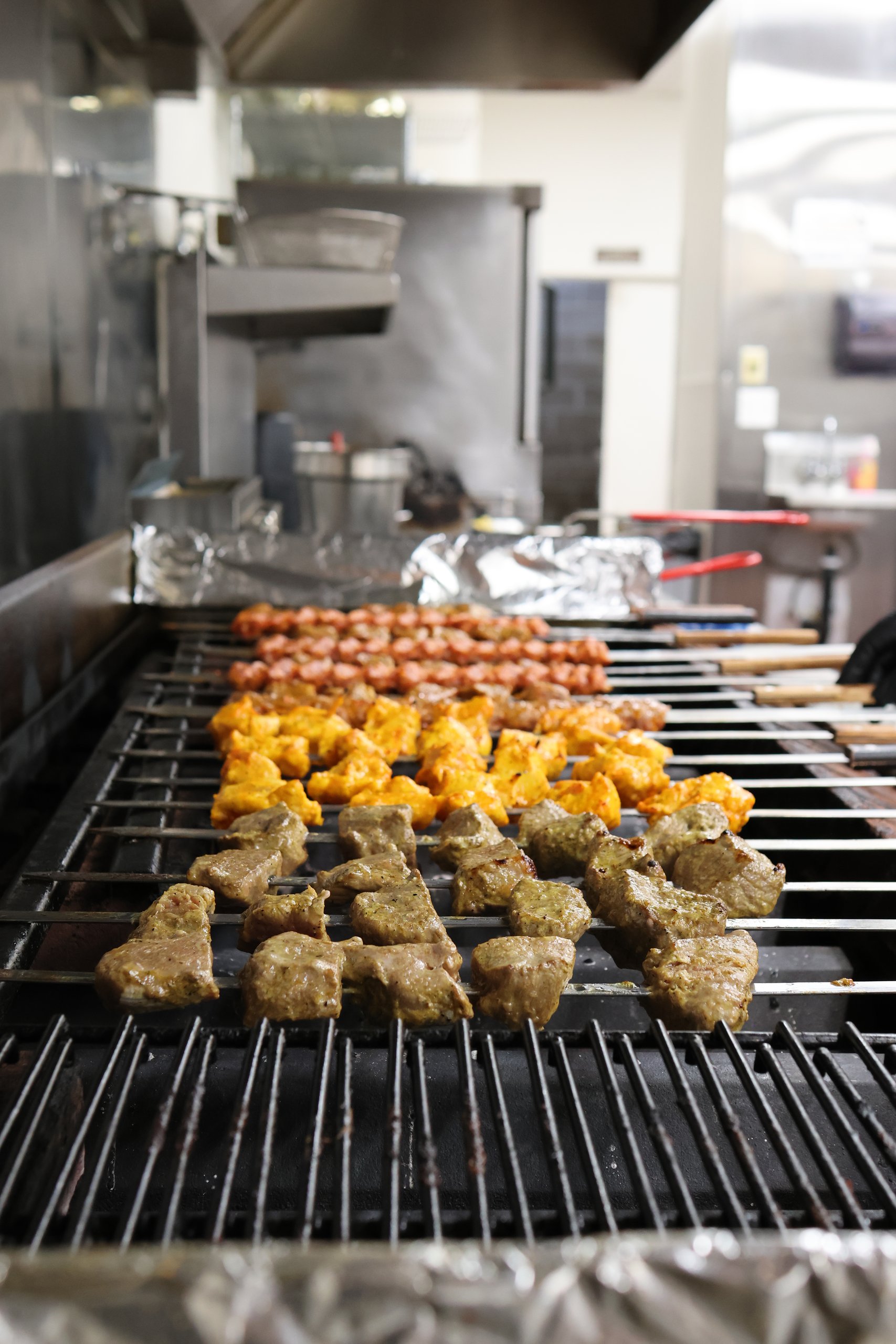 Elaborate mixed grill platter with koobideh, shish kebab, and saffron rice